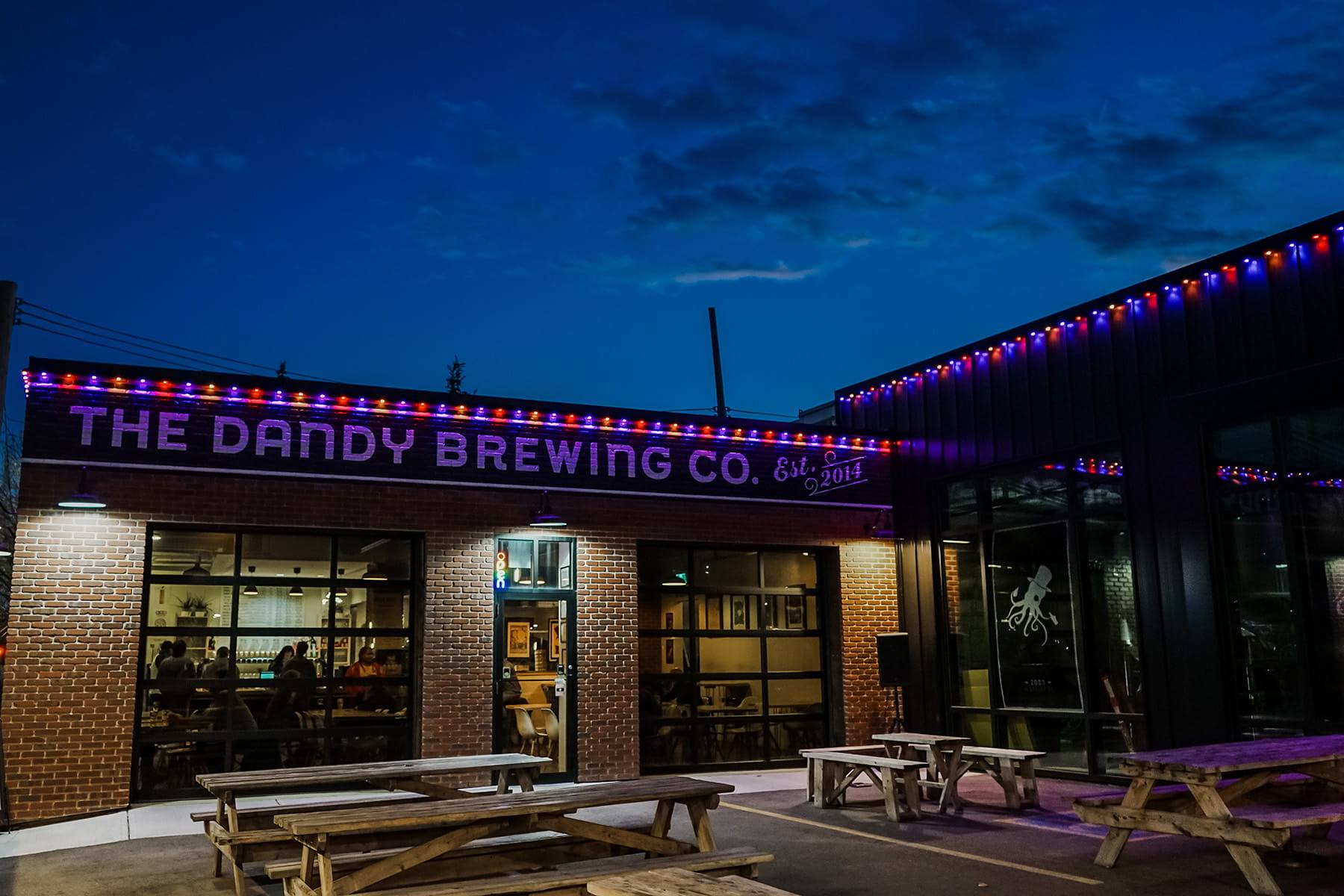 Brewery with purple Gemstone lights over the patio
