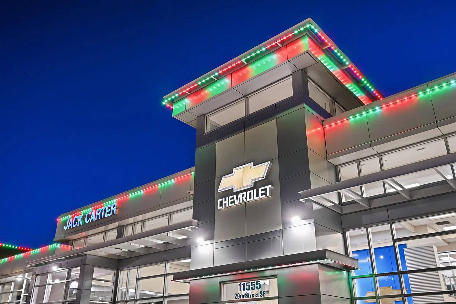 The dealership with red and green Christmas lights