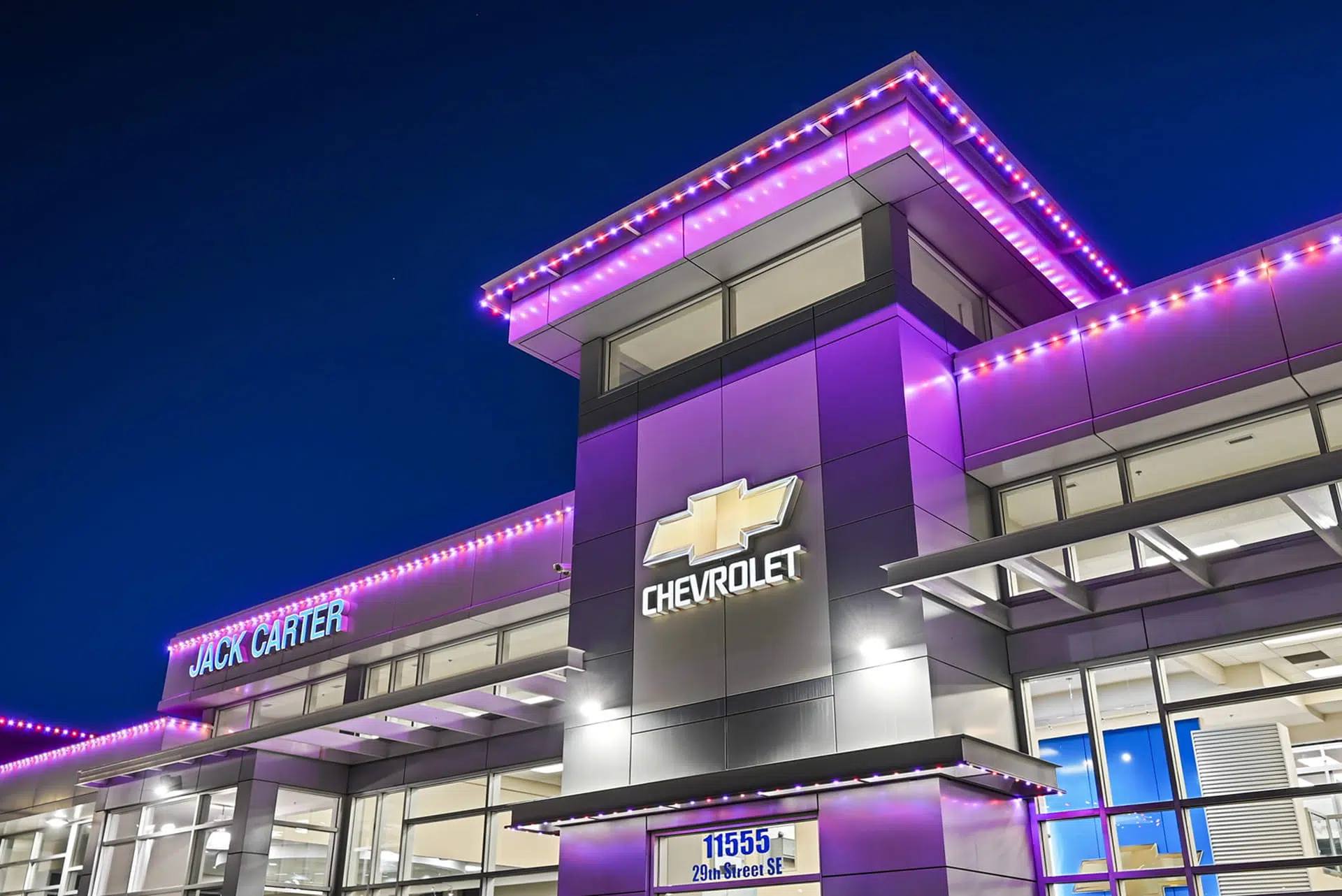 The dealership lit purple for Halloween