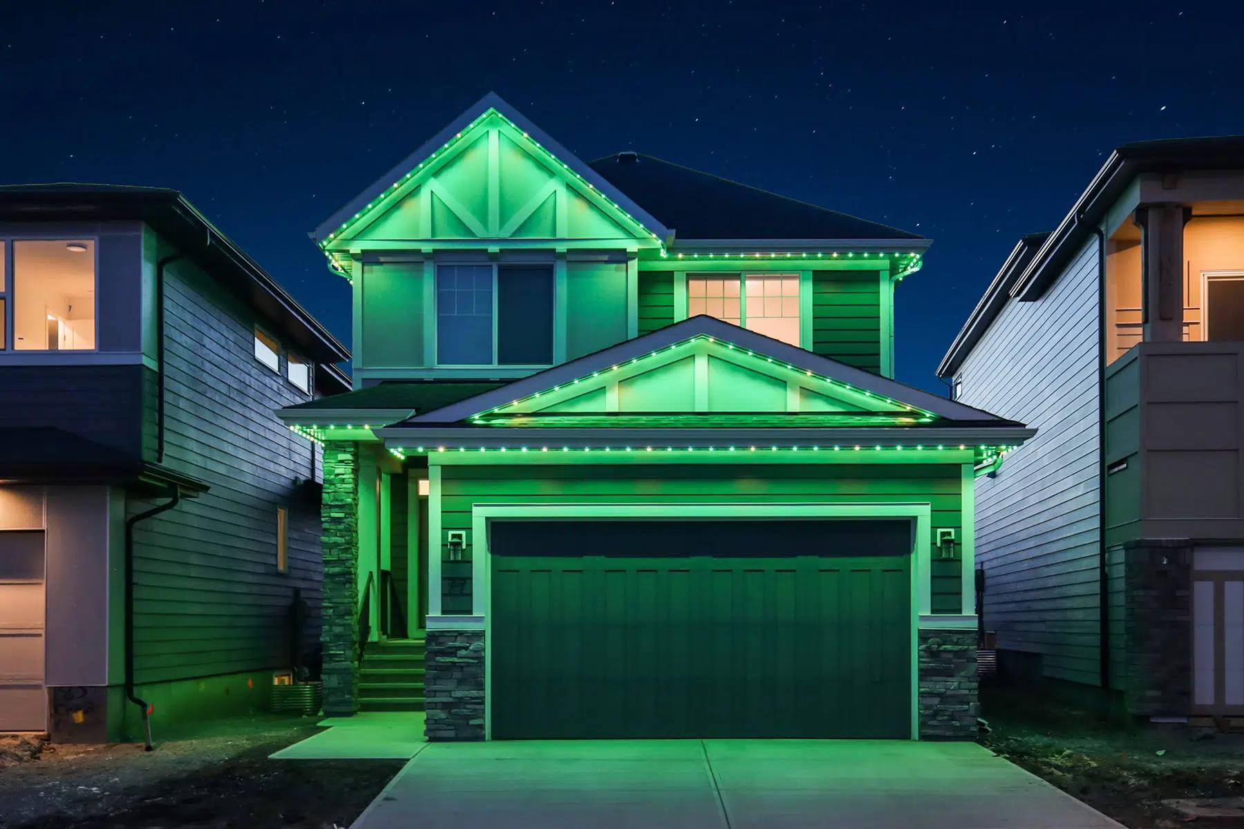 Home lit in bright green Gemstone lights for game day