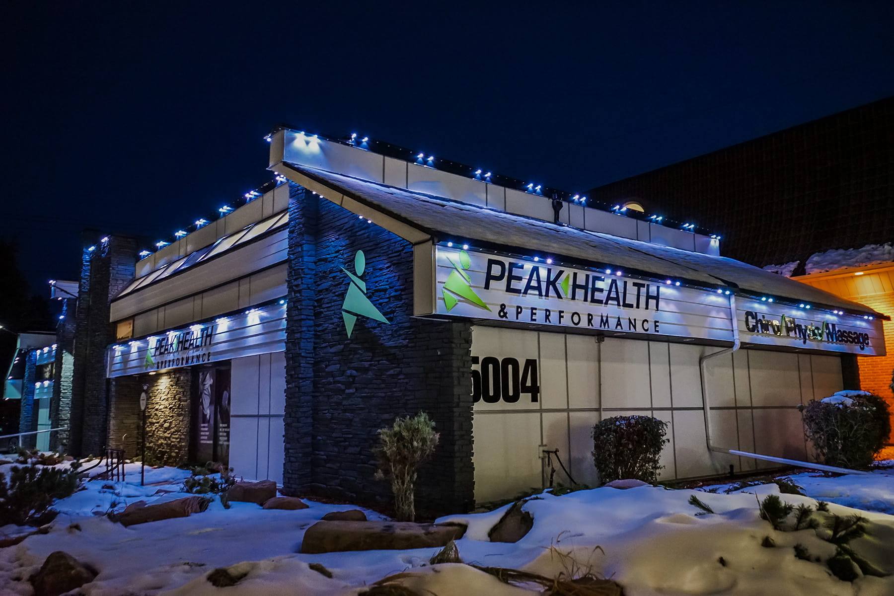 Health clinic in winter with blue Gemstone lights along the roof