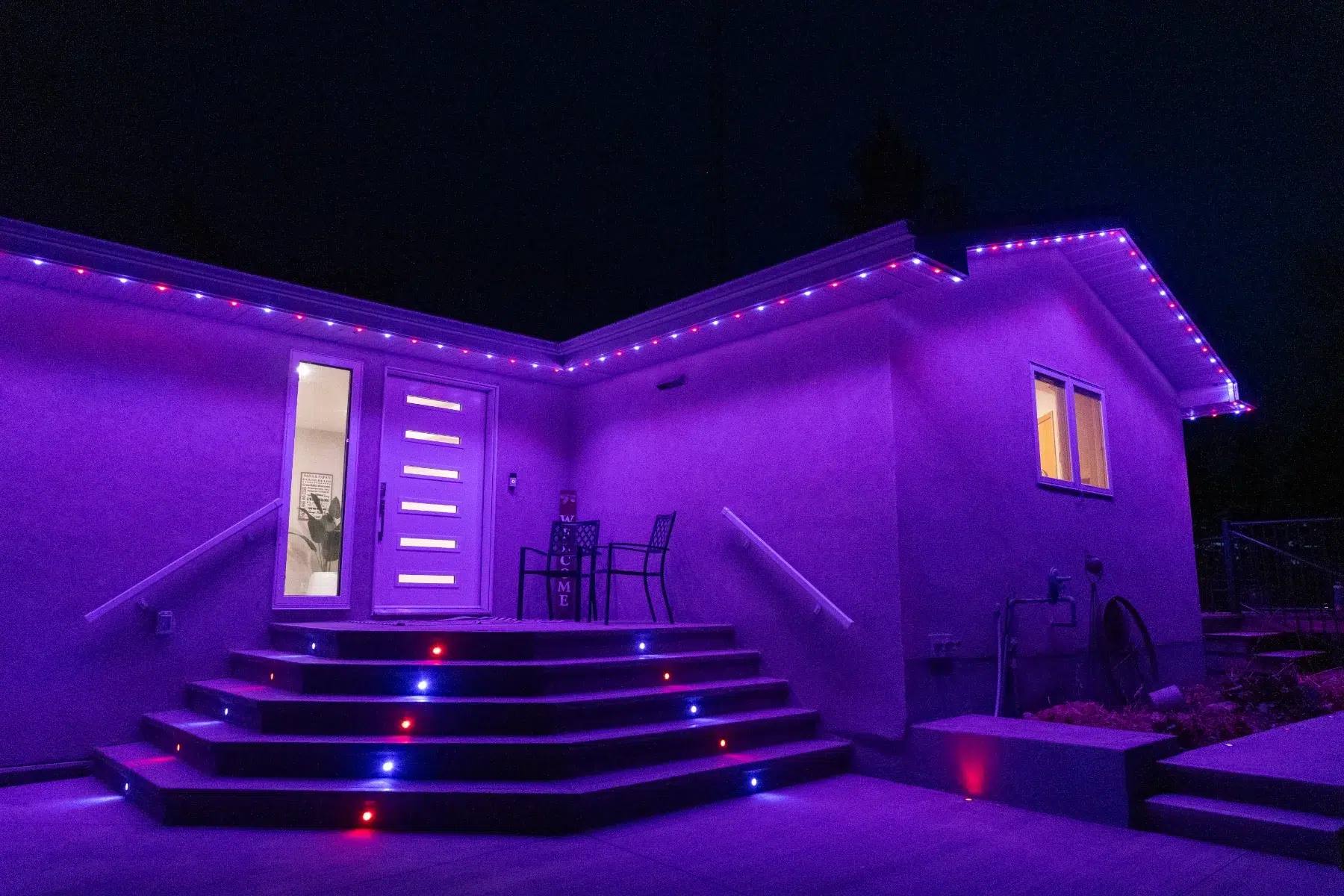 The same steps and house lit purple