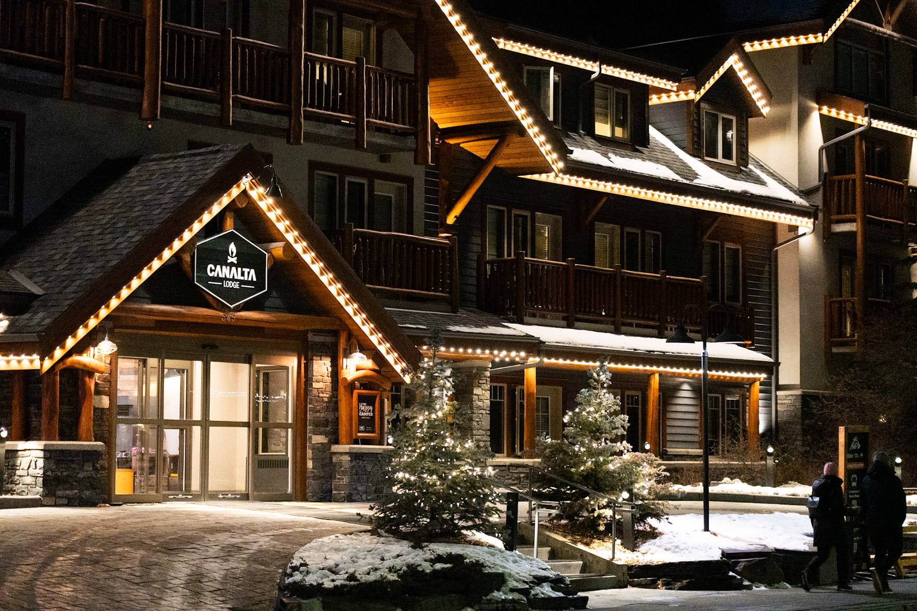 Mountain lodge in the snow with warm white Gemstone lights