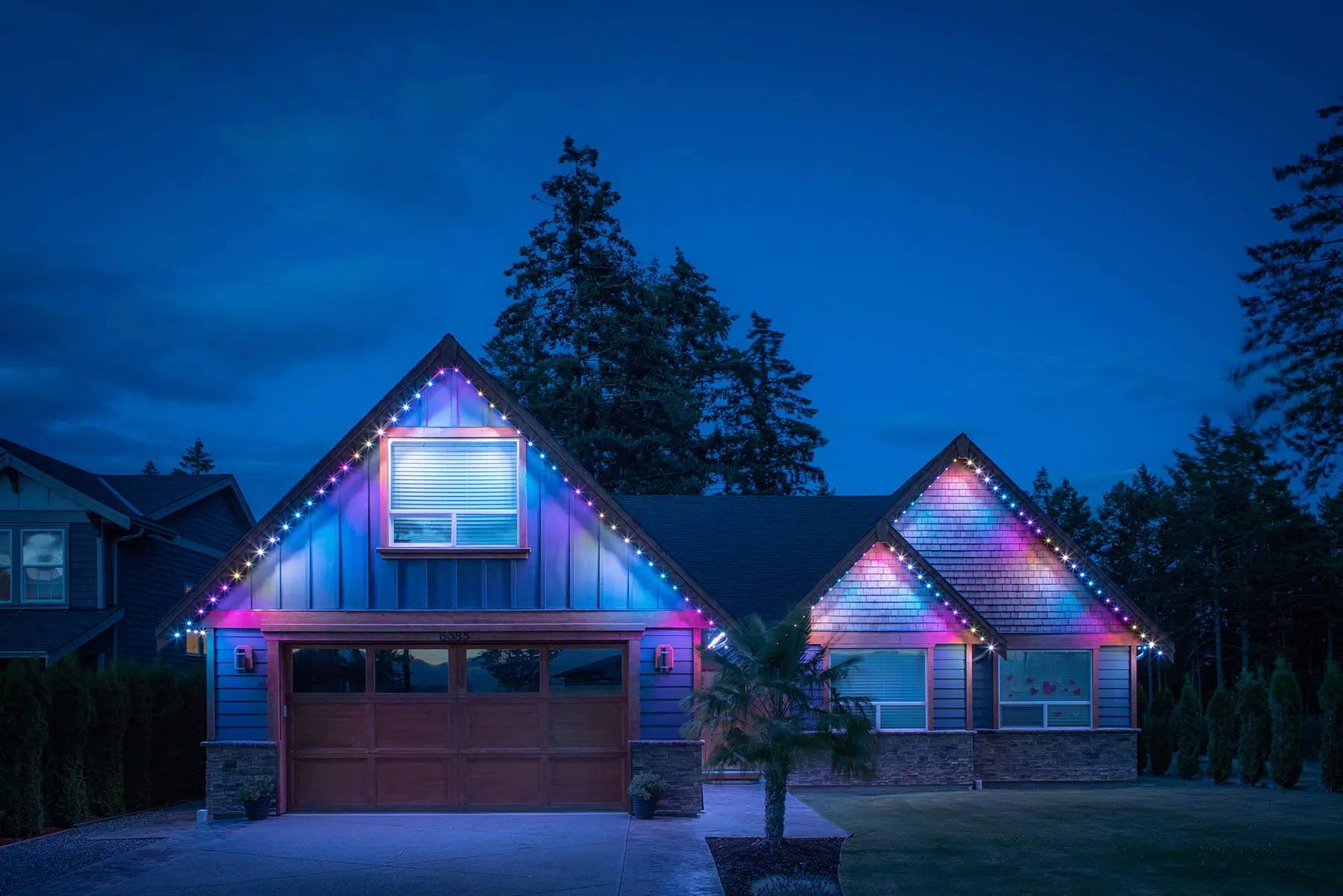 Home with rainbow multicolour Gemstone roofline lights