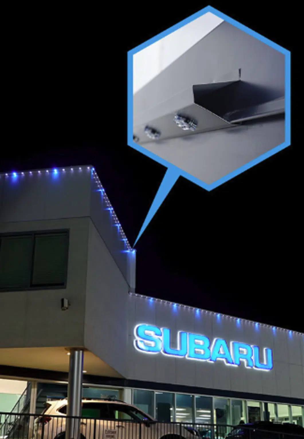 Commercial side-mount Gemstone track on a car dealership